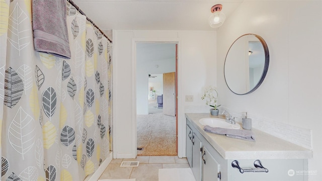 full bathroom featuring vanity, tile patterned floors, and visible vents