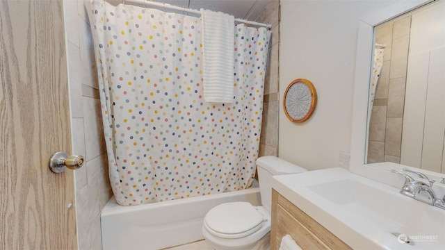 bathroom featuring shower / tub combo with curtain, toilet, and vanity