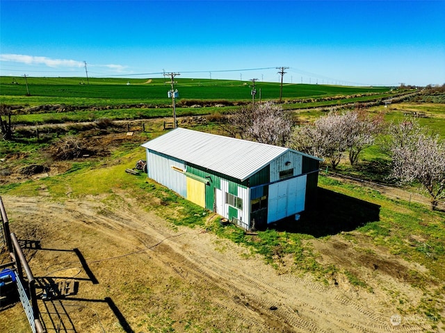 birds eye view of property featuring a rural view