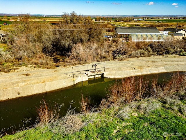 view of property's community with a water view