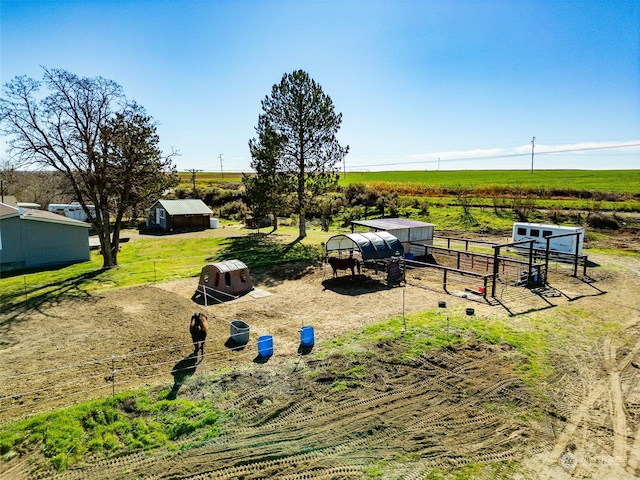surrounding community with a rural view and an outbuilding