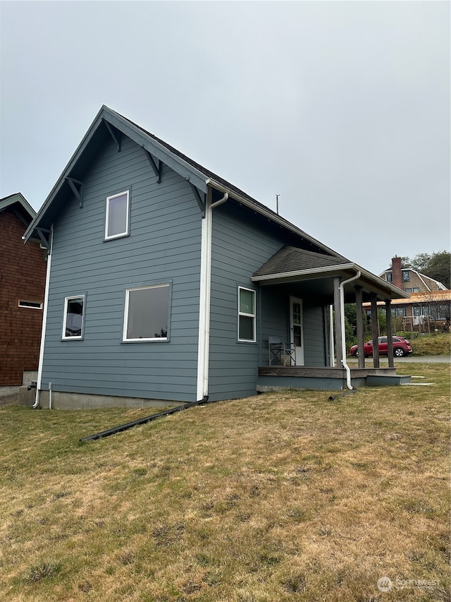 rear view of house with a lawn