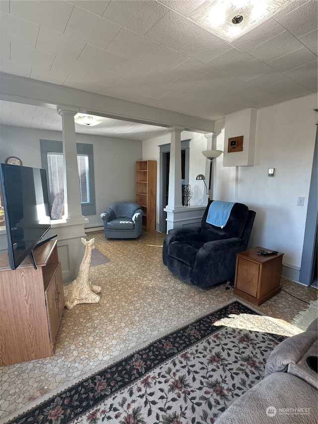 living room with carpet floors and baseboard heating