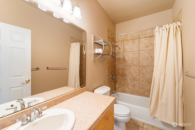 full bathroom featuring vanity, shower / bath combo with shower curtain, toilet, and tile patterned flooring