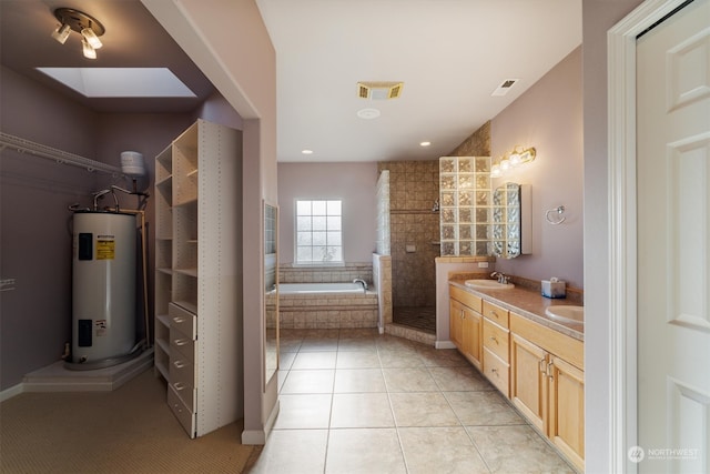 bathroom featuring independent shower and bath, water heater, vanity, and tile patterned floors