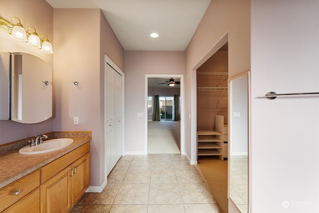 bathroom featuring vanity, ceiling fan, and tile patterned floors