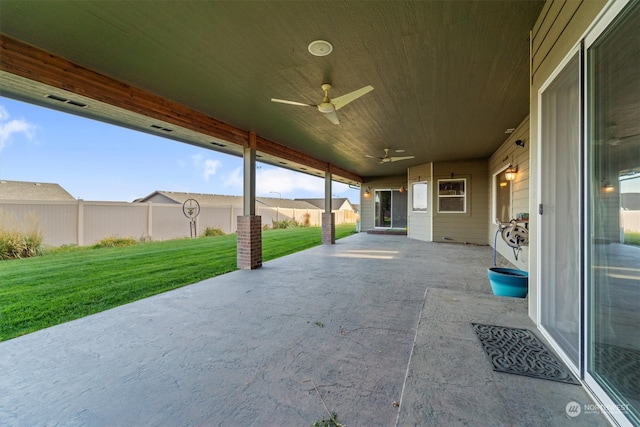 view of patio featuring ceiling fan