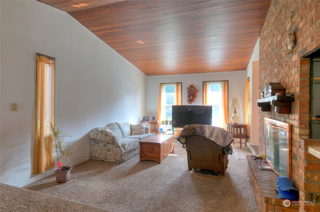 carpeted living room featuring wood ceiling, a fireplace, and lofted ceiling