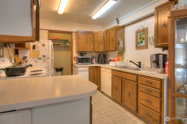 kitchen with sink and white appliances