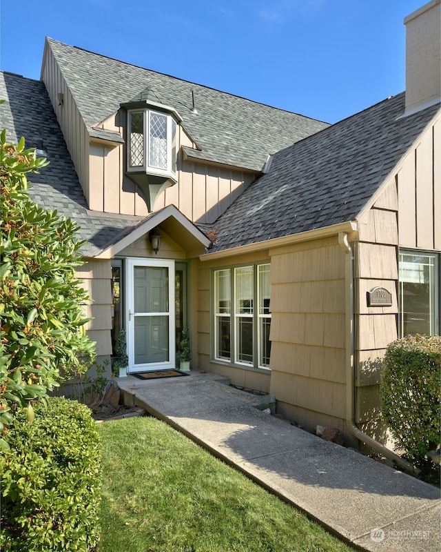 rear view of house with a yard