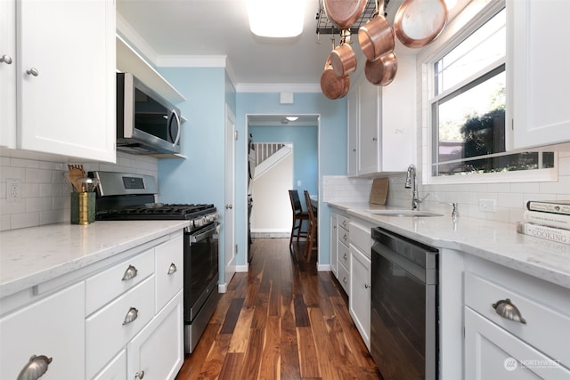 kitchen featuring white cabinets, stainless steel appliances, dark wood-type flooring, and sink