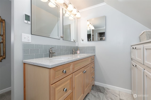 bathroom with backsplash, vanity, and crown molding