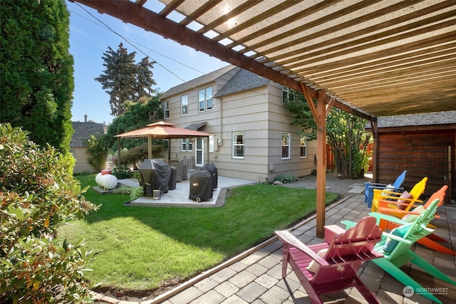 exterior space with a lawn, a pergola, and a patio area