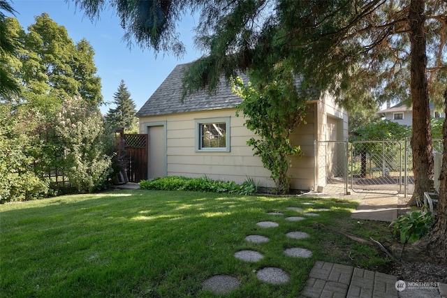 view of outdoor structure with a lawn