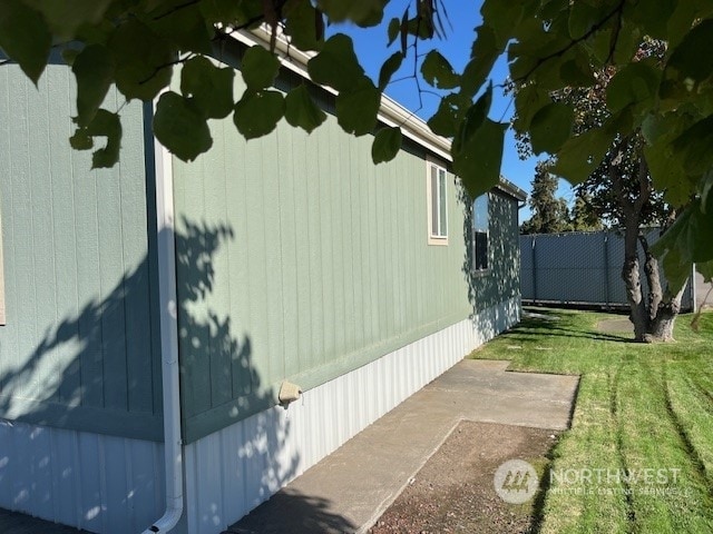 view of property exterior featuring a yard