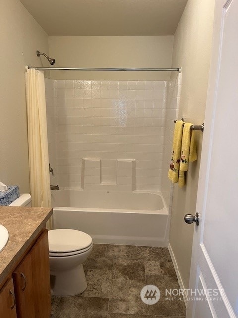 full bathroom featuring shower / bath combo, vanity, and toilet