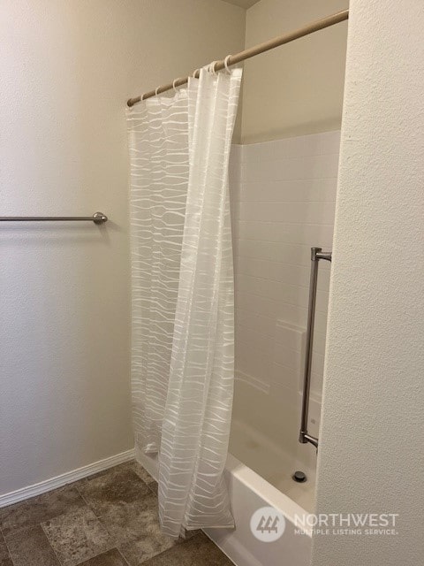 bathroom featuring shower / tub combo