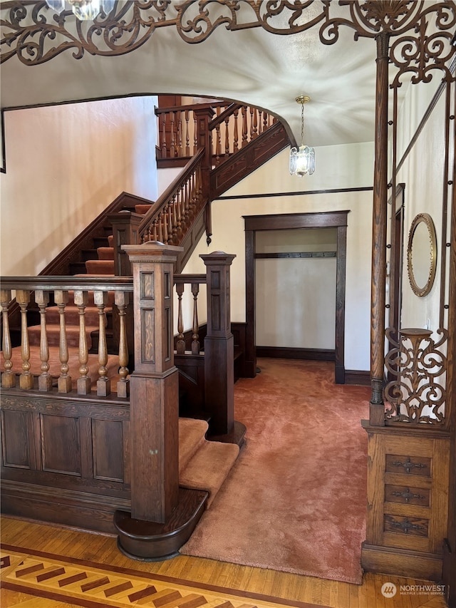 interior space featuring hardwood / wood-style flooring and a notable chandelier