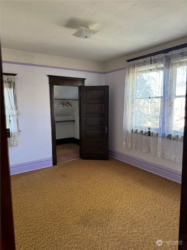 empty room featuring carpet floors