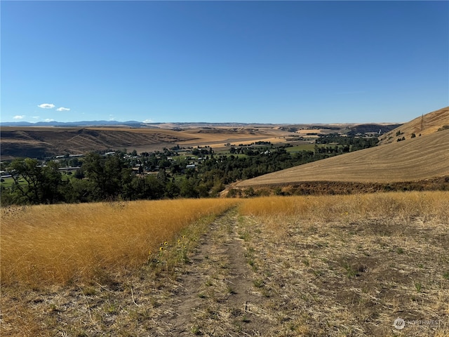 view of mountain feature with a rural view