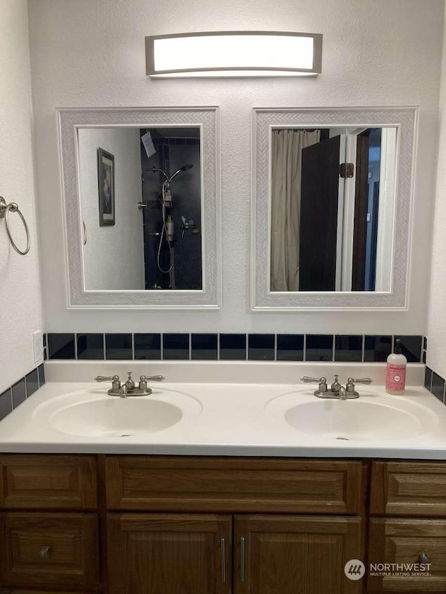 bathroom featuring tasteful backsplash and vanity