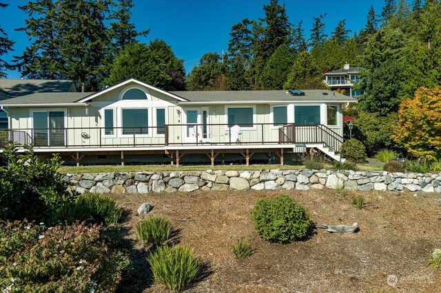 rear view of house with a deck