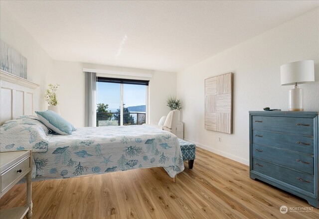 bedroom with light wood-type flooring