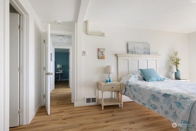 bedroom with light hardwood / wood-style floors