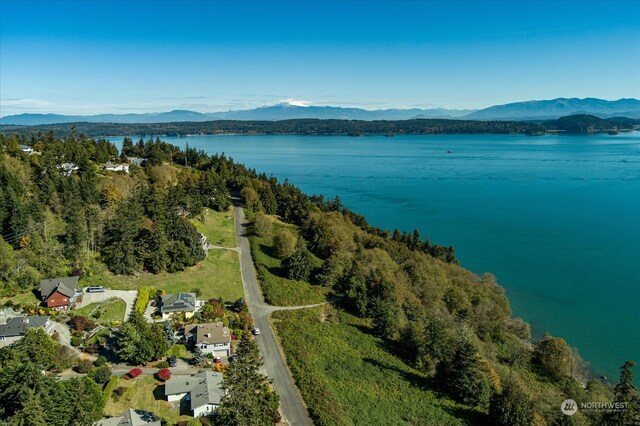 aerial view featuring a water and mountain view