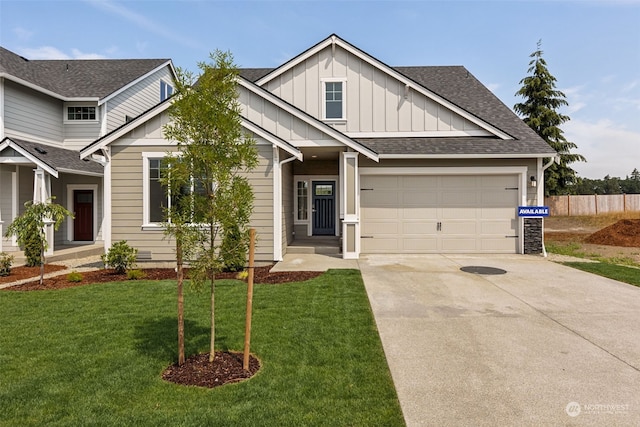 craftsman inspired home featuring a front lawn and a garage