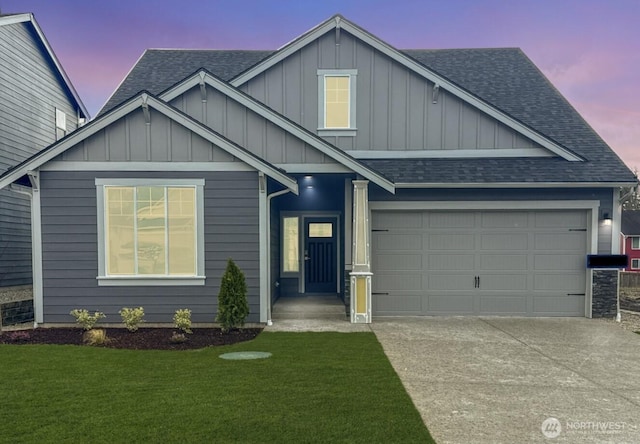 view of front of property with roof with shingles, board and batten siding, concrete driveway, and an attached garage