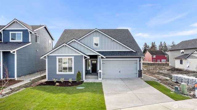 14727 88th Way SE Unit 18, Yelm, WA 98597 - craftsman house featuring fence, driveway, a front yard, board and batten siding, and a shingled roof