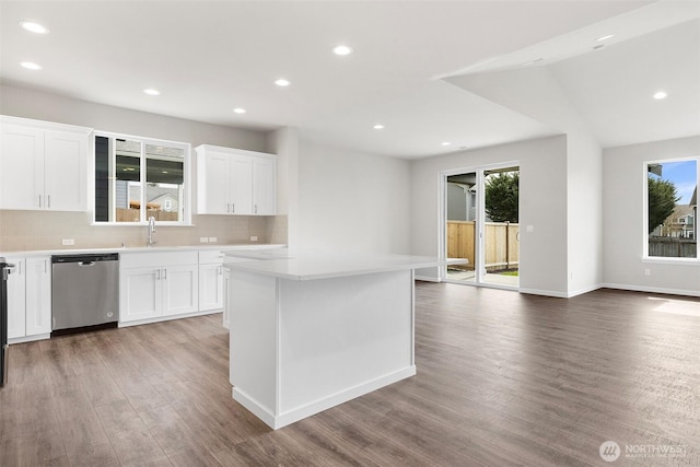 14727 88th Way SE Unit 18, Yelm, WA 98597 - kitchen featuring light wood-type flooring, recessed lighting, dishwasher, light countertops, and decorative backsplash