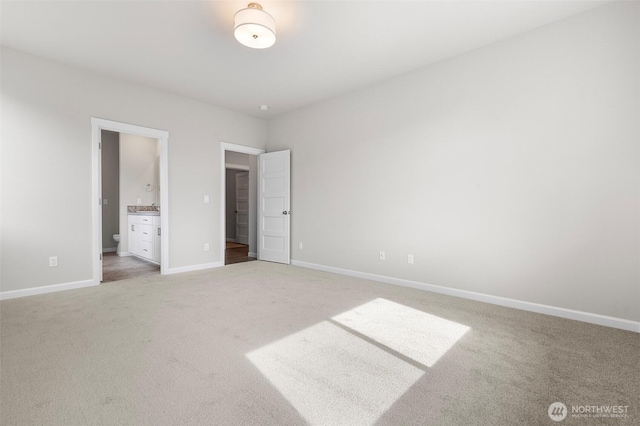 14727 88th Way SE Unit 18, Yelm, WA 98597 - unfurnished bedroom featuring light colored carpet, connected bathroom, and baseboards