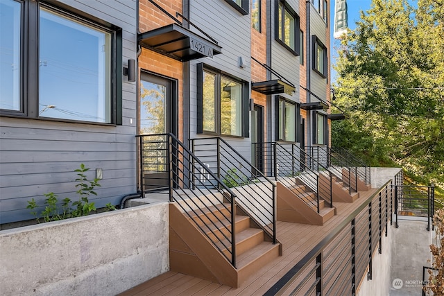 entrance to property with a balcony