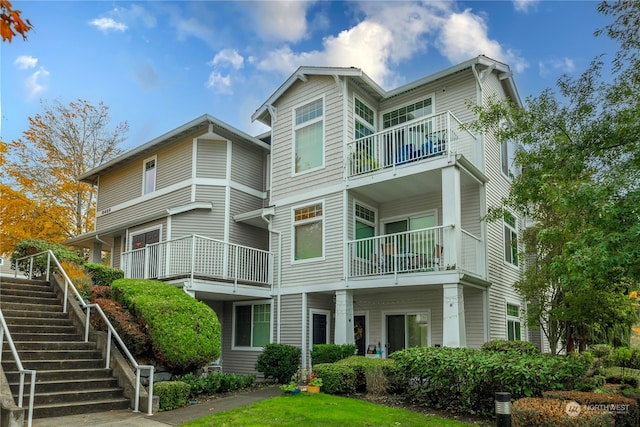 back of property with a balcony