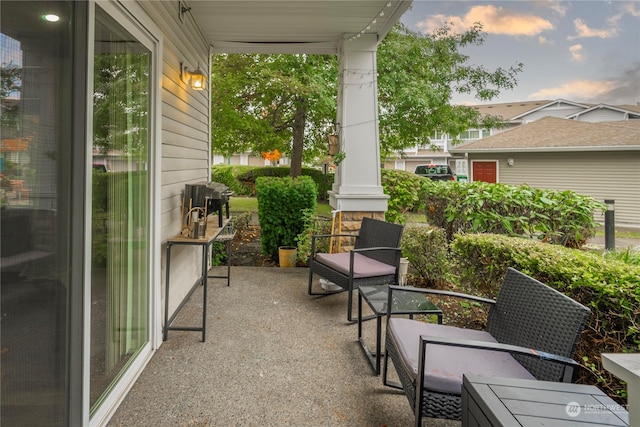 view of patio terrace at dusk