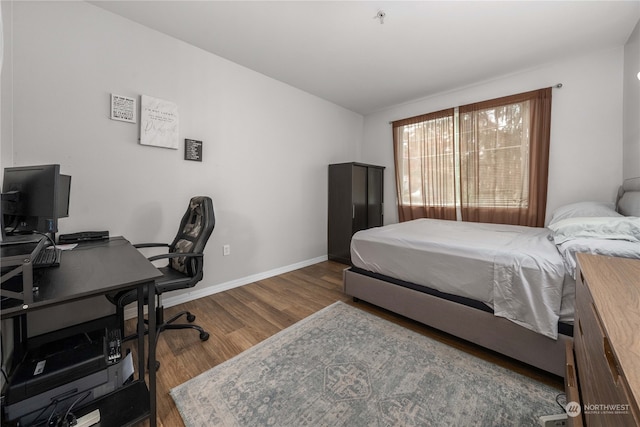 bedroom with hardwood / wood-style flooring