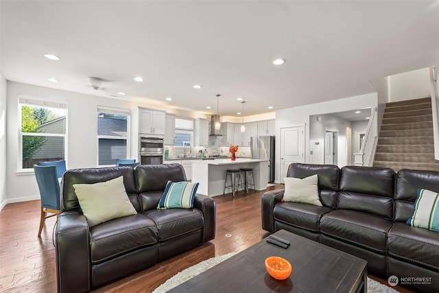 living room featuring dark hardwood / wood-style flooring