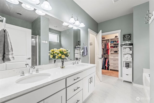 bathroom featuring independent shower and bath and vanity