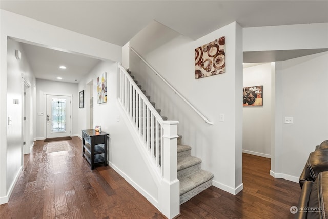 stairs with hardwood / wood-style flooring