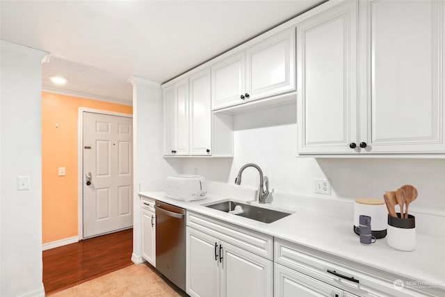 kitchen featuring dishwasher, light hardwood / wood-style flooring, sink, and white cabinetry