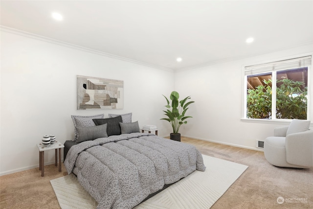 bedroom with light carpet and crown molding