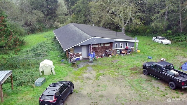 birds eye view of property featuring a view of trees