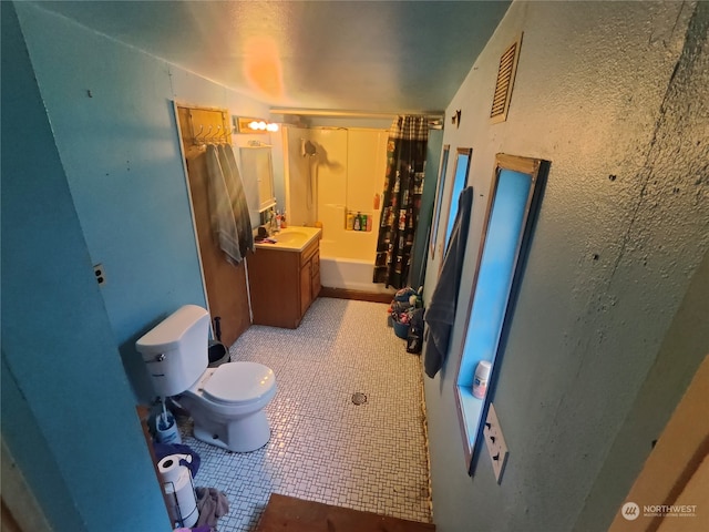 full bathroom featuring shower / tub combo, tile patterned floors, vanity, and toilet