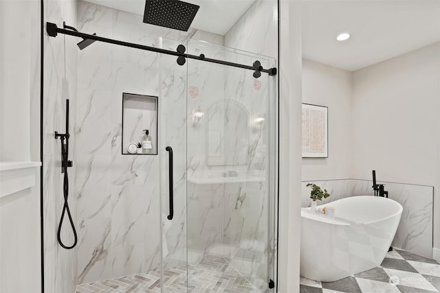 bathroom with shower with separate bathtub