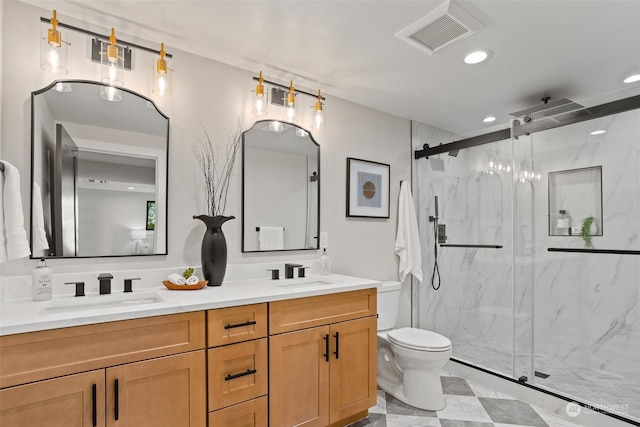 bathroom featuring vanity, toilet, and walk in shower