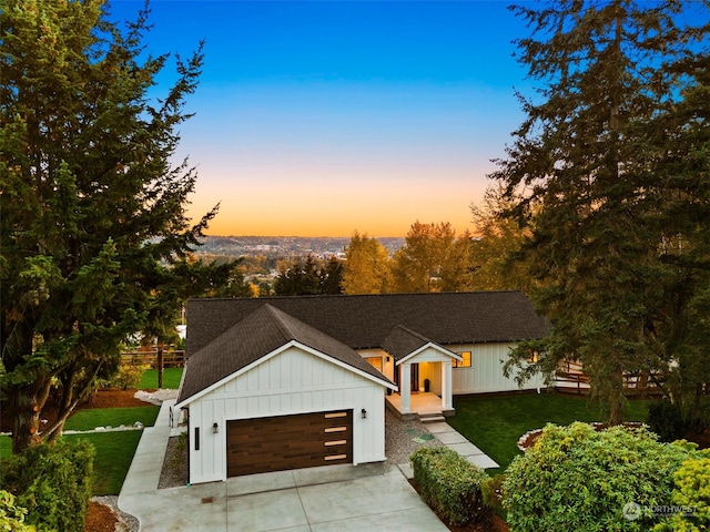 view of front of house featuring a yard and a garage