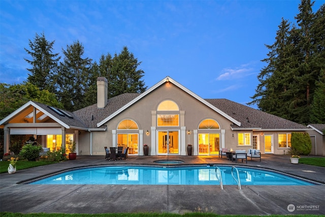 rear view of house with a patio and french doors