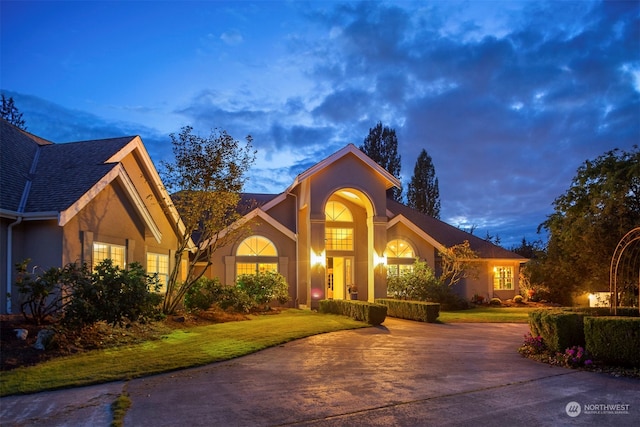 view of front of home with a lawn